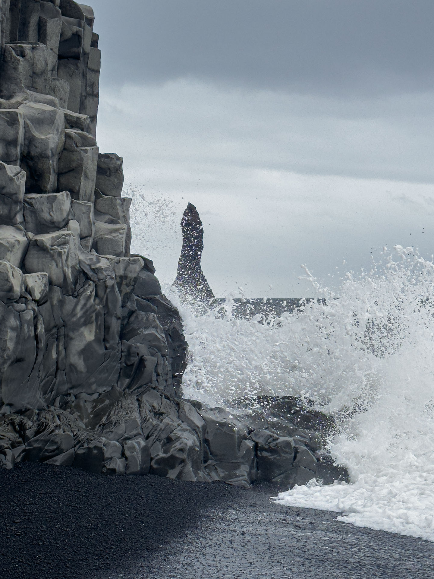 Waves crashing at Reynisdrangar Basalt Stacks on Arctic Adventures South Shore Adventure Tour